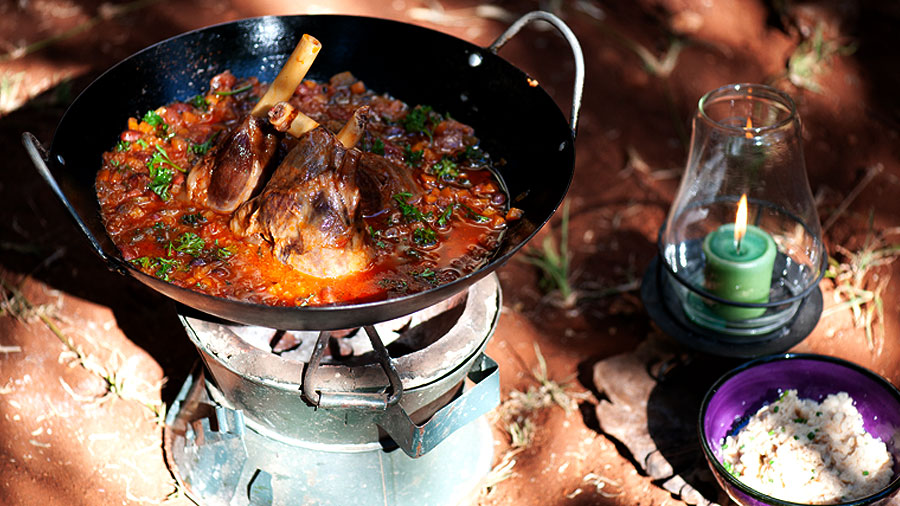 Poikje Braised lamb shanks with, lemon and parsley gremolata, borlotti bean, roasted garlic and thyme